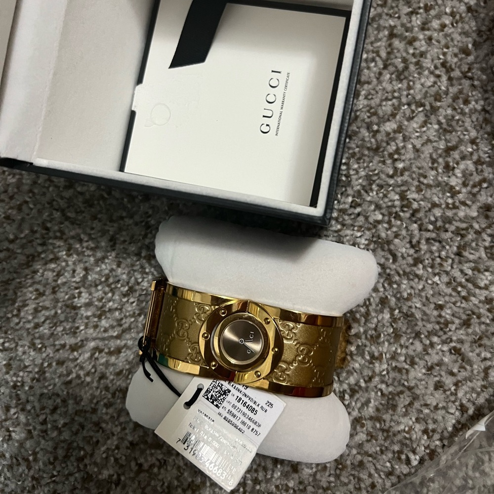 Gucci watch like brand new worn couple times 50% off the original tag